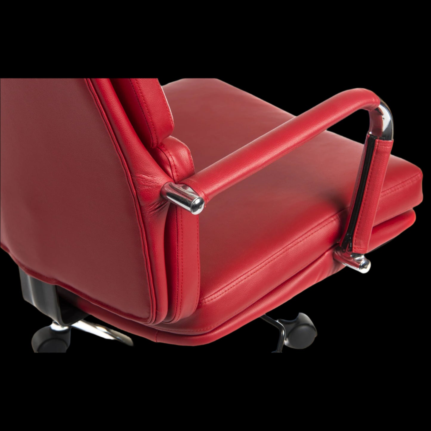 Red office chair with armrests on a black background