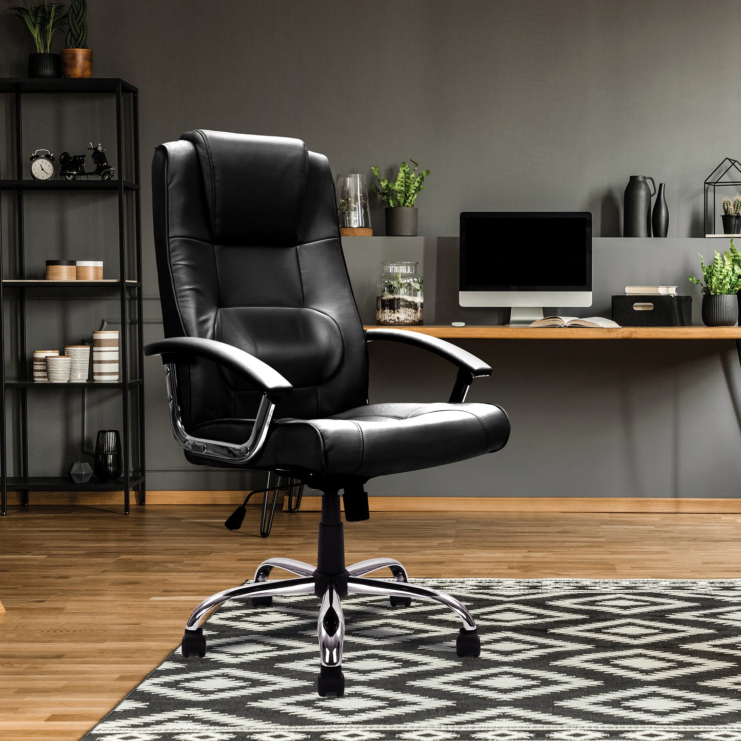 Black leather office chair in a modern room with a desk and decor.