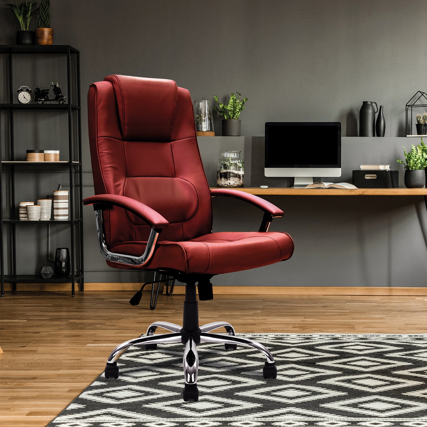 Red office chair in a home office setting with a desk and decor.
