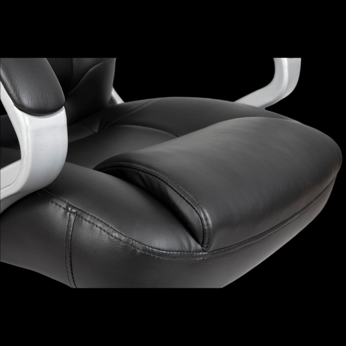 Black office chair seat with white armrests on a black background