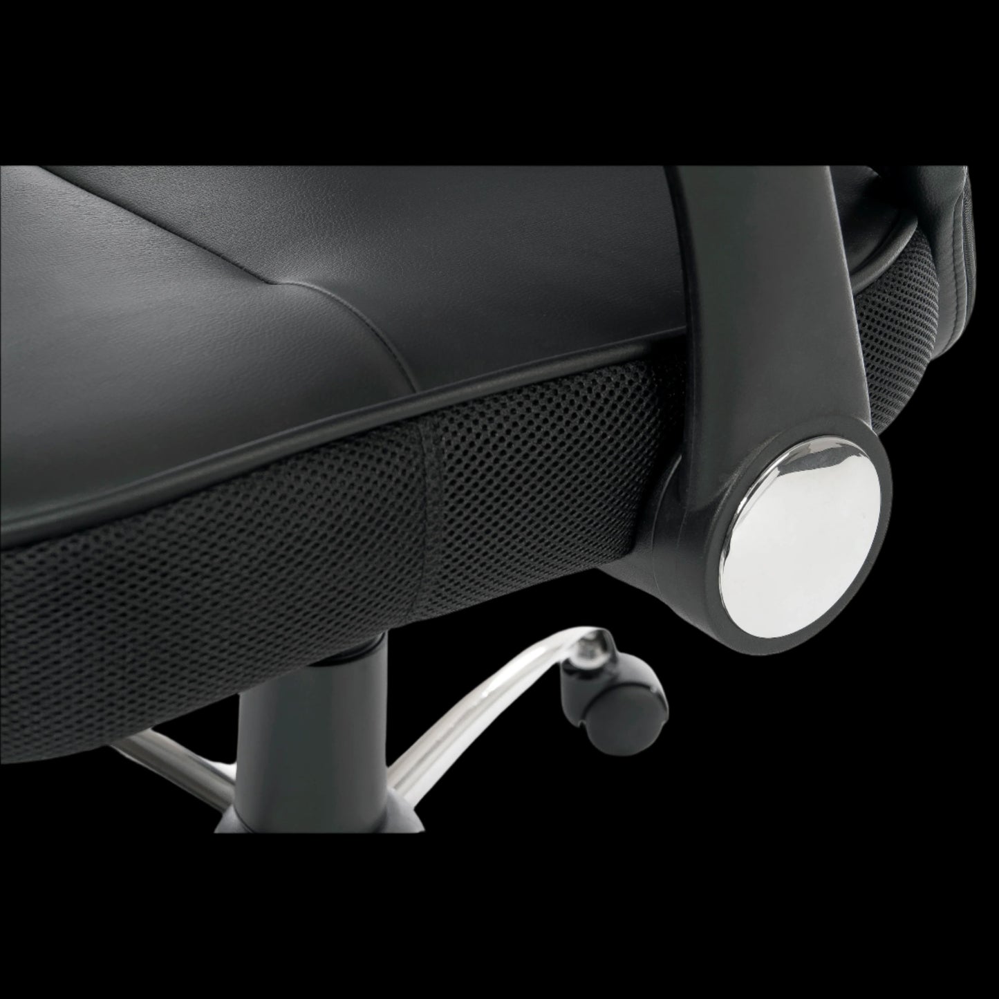 Close-up of a black office chair with wheels on a black background