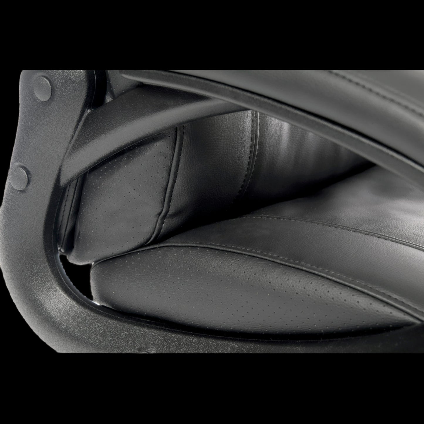 Close-up of a black leather office chair with armrests.