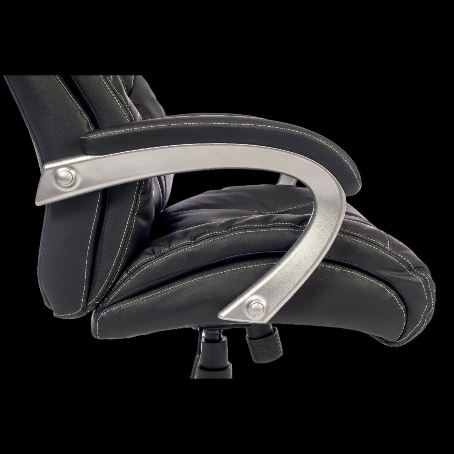 Close-up of a black office chair with armrests on a black background