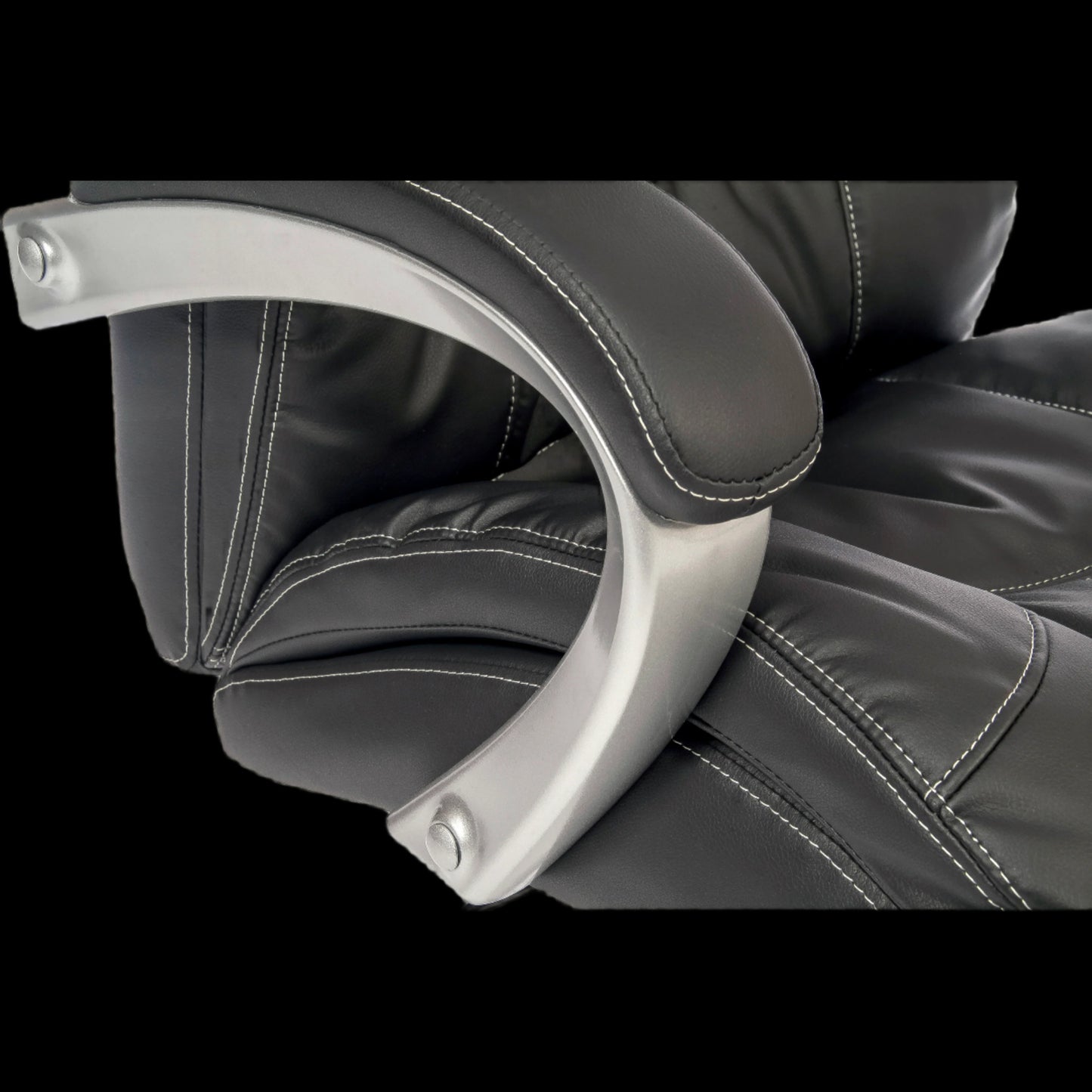 Close-up of a black leather chair with armrests on a black background