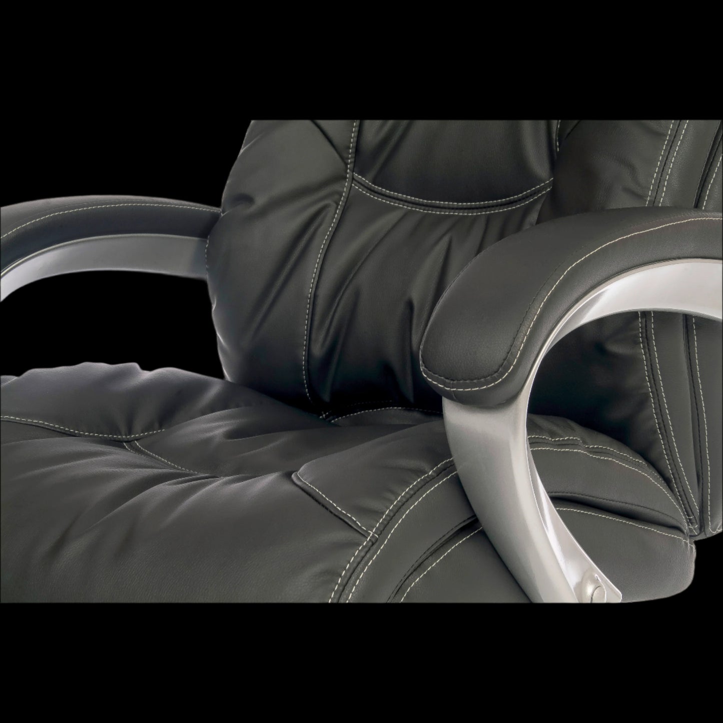 Close-up of a black office chair with armrests and backrest.