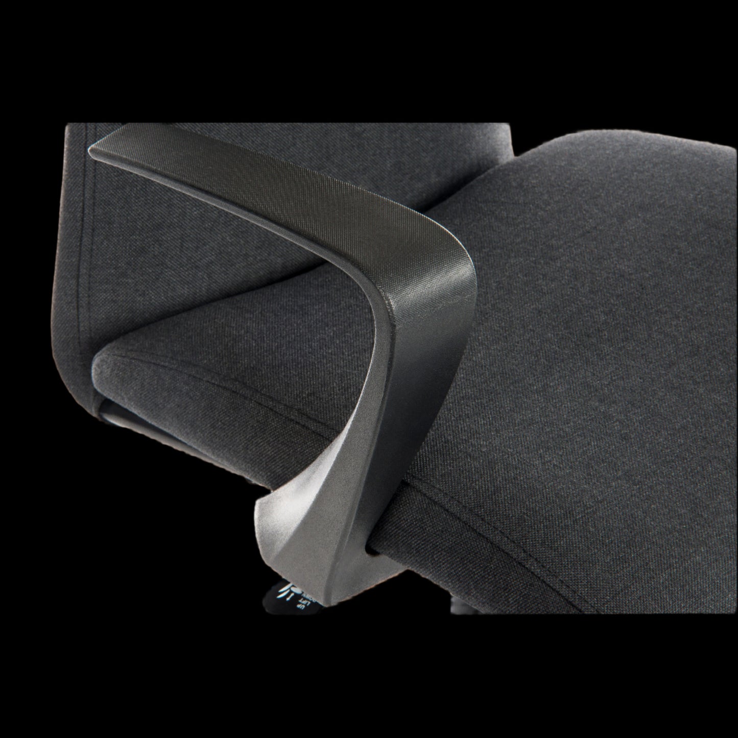 black office chair with armrest detail on a black background