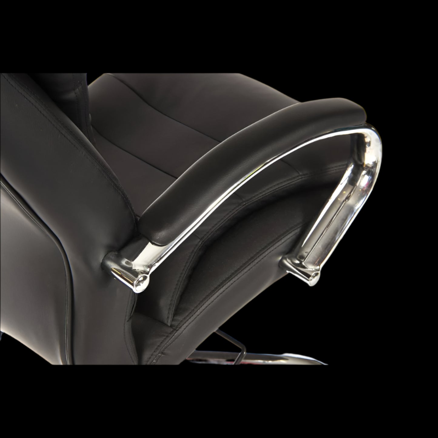 Close-up of a black office chair with chrome accents on a black background