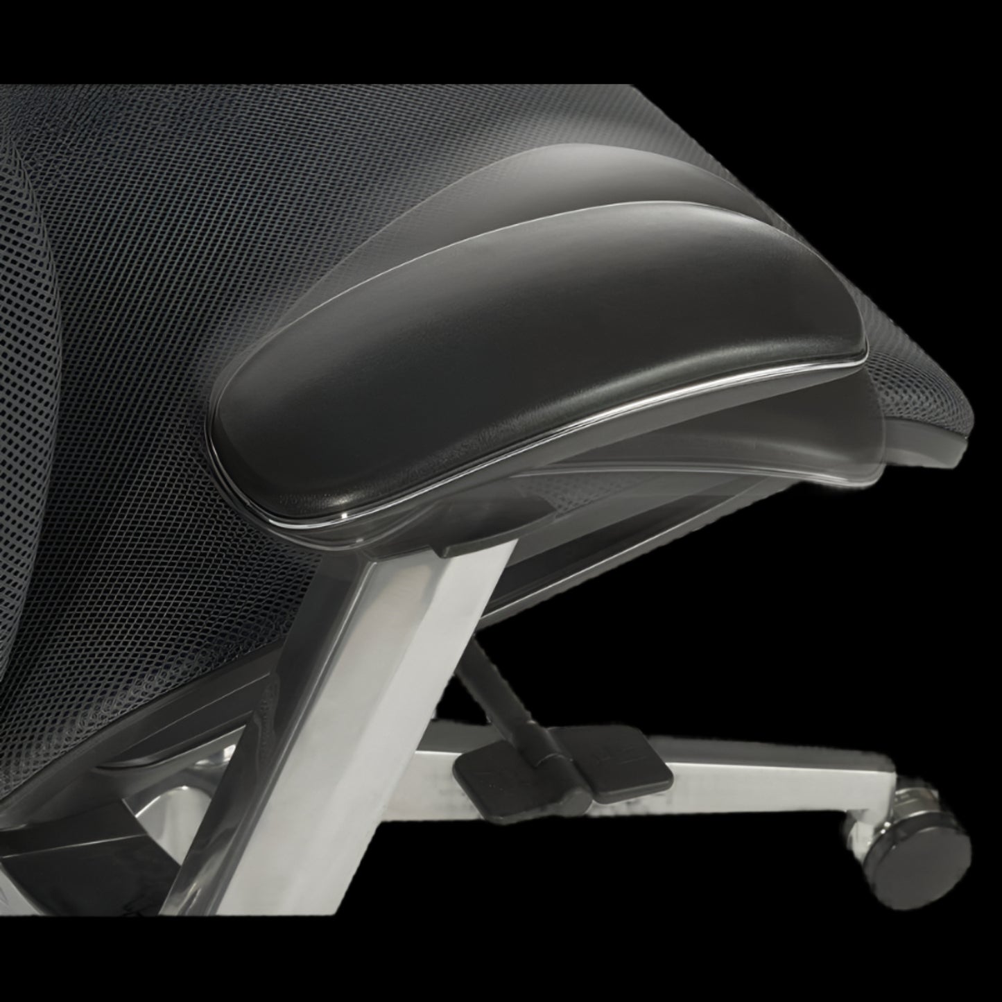 Black office chair with mesh backrest and armrests on a black background