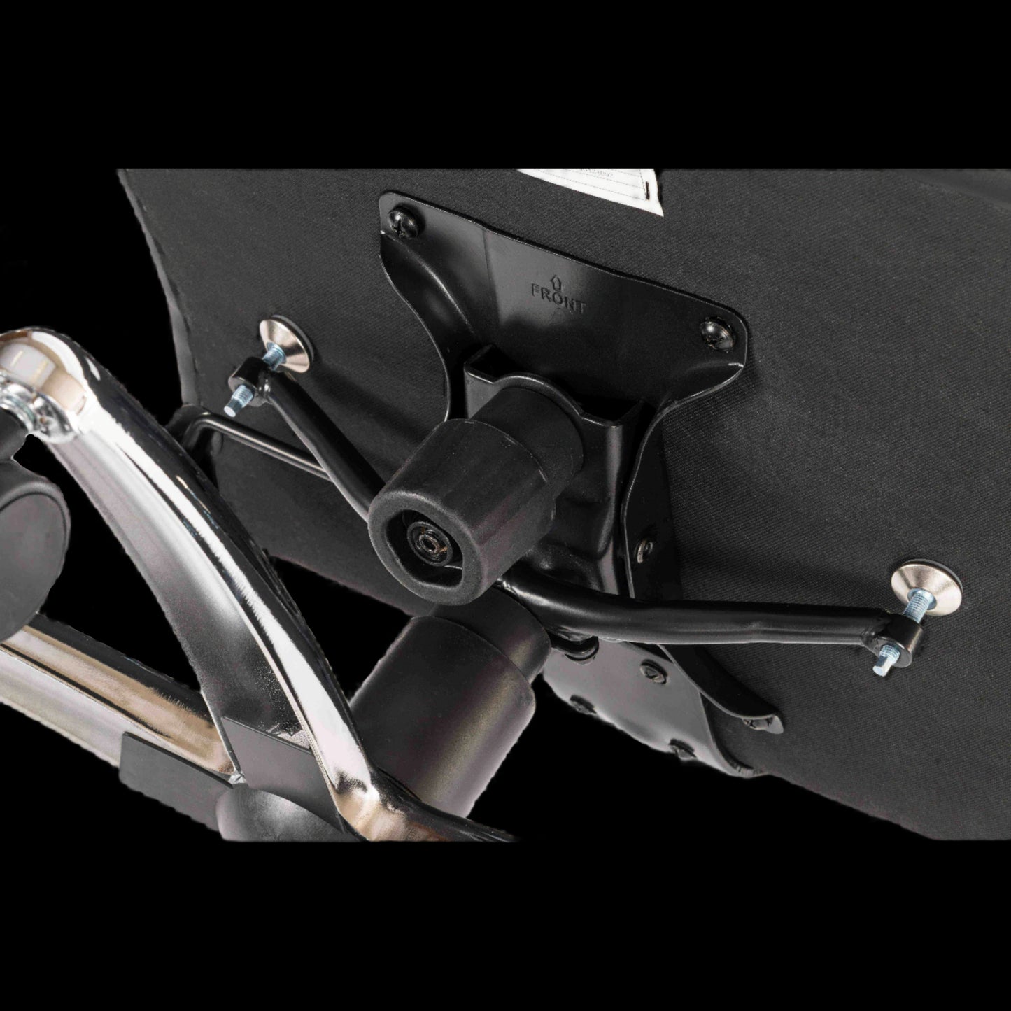 Close-up of a motorcycle exhaust system with a black background