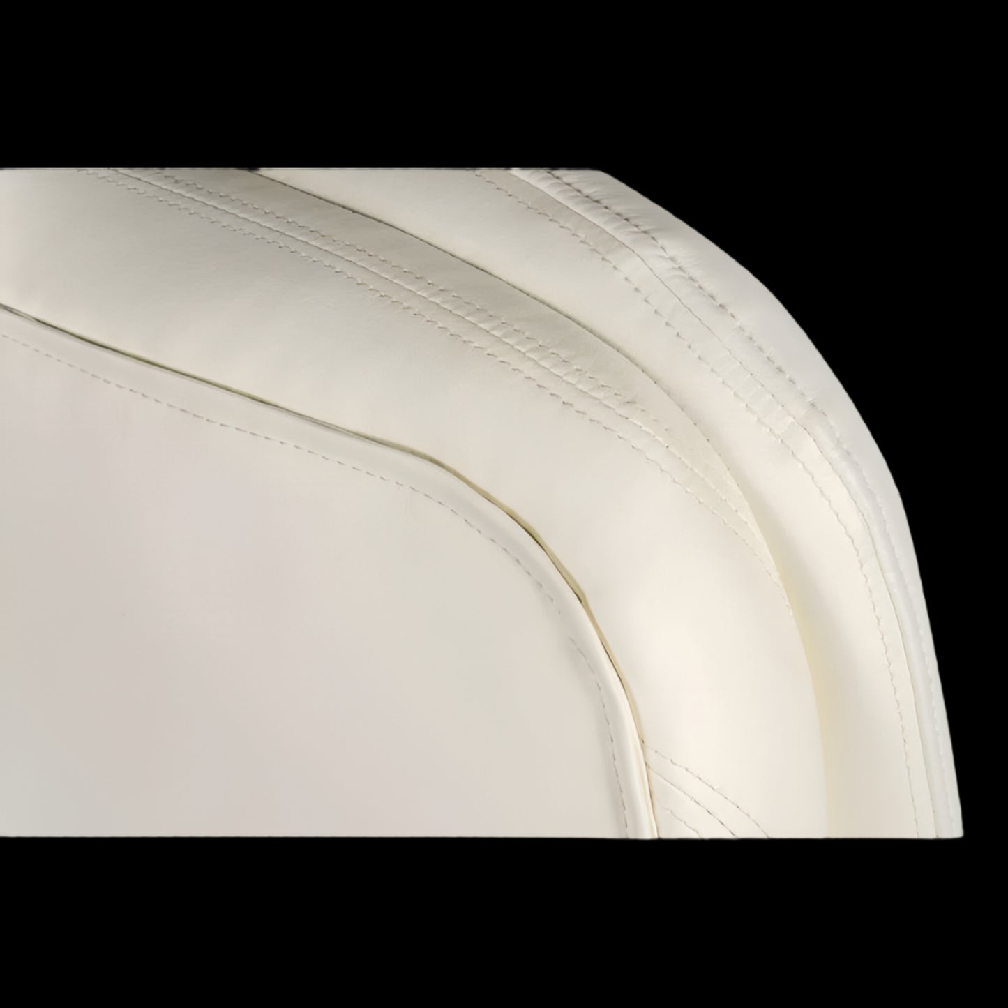 Close-up of a white car seat with visible stitching on a black background