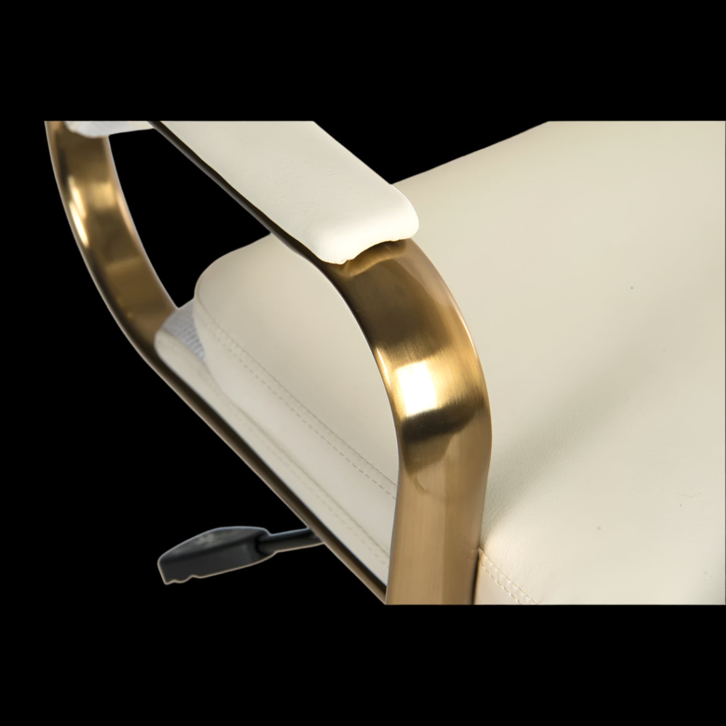 Chair with gold armrests and white cushion on a black background
