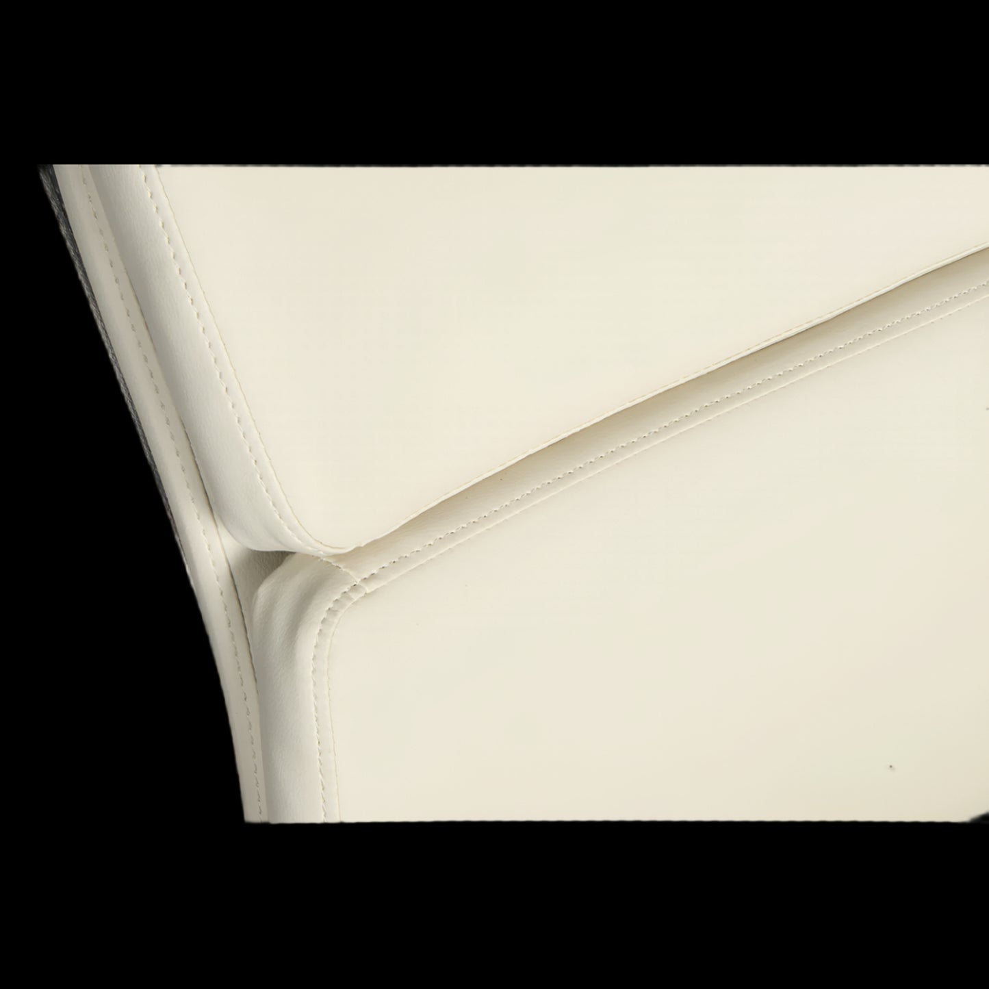 Close-up of a white leather surface with a subtle pattern