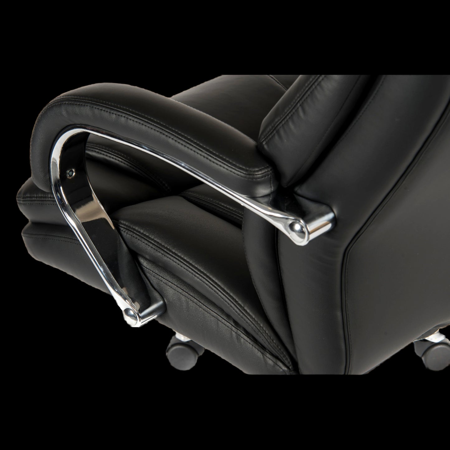 Close-up of a black office chair with a metallic armrest on a black background