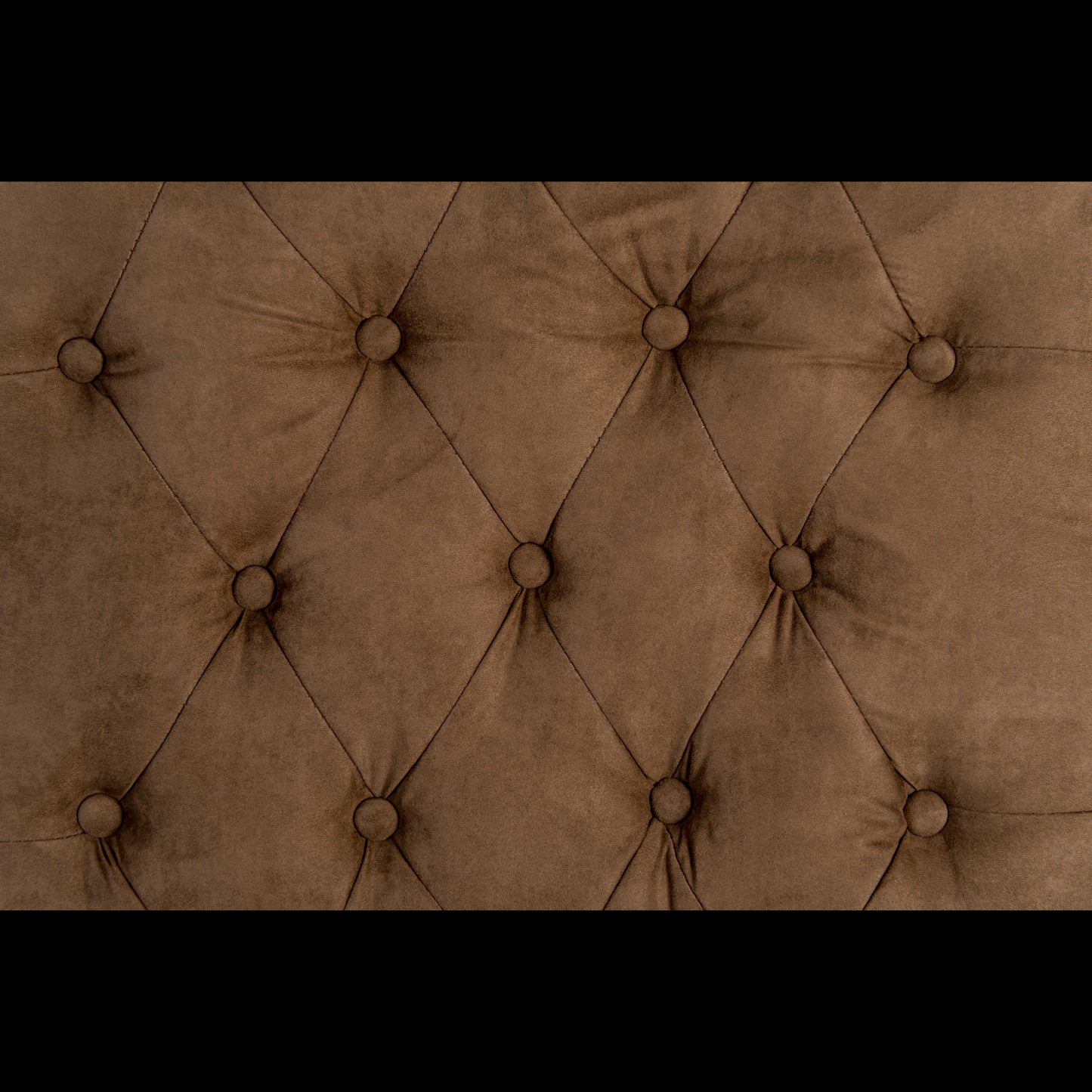 Close-up of a brown tufted fabric surface