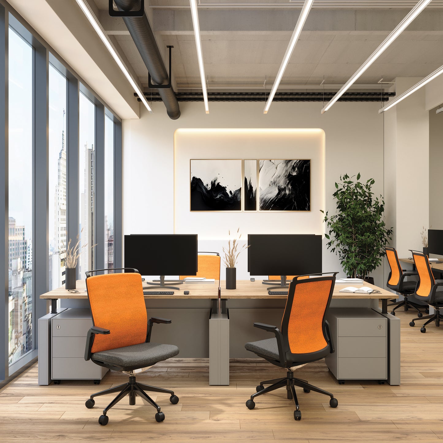 Modern office space with desks, chairs, and large windows.
