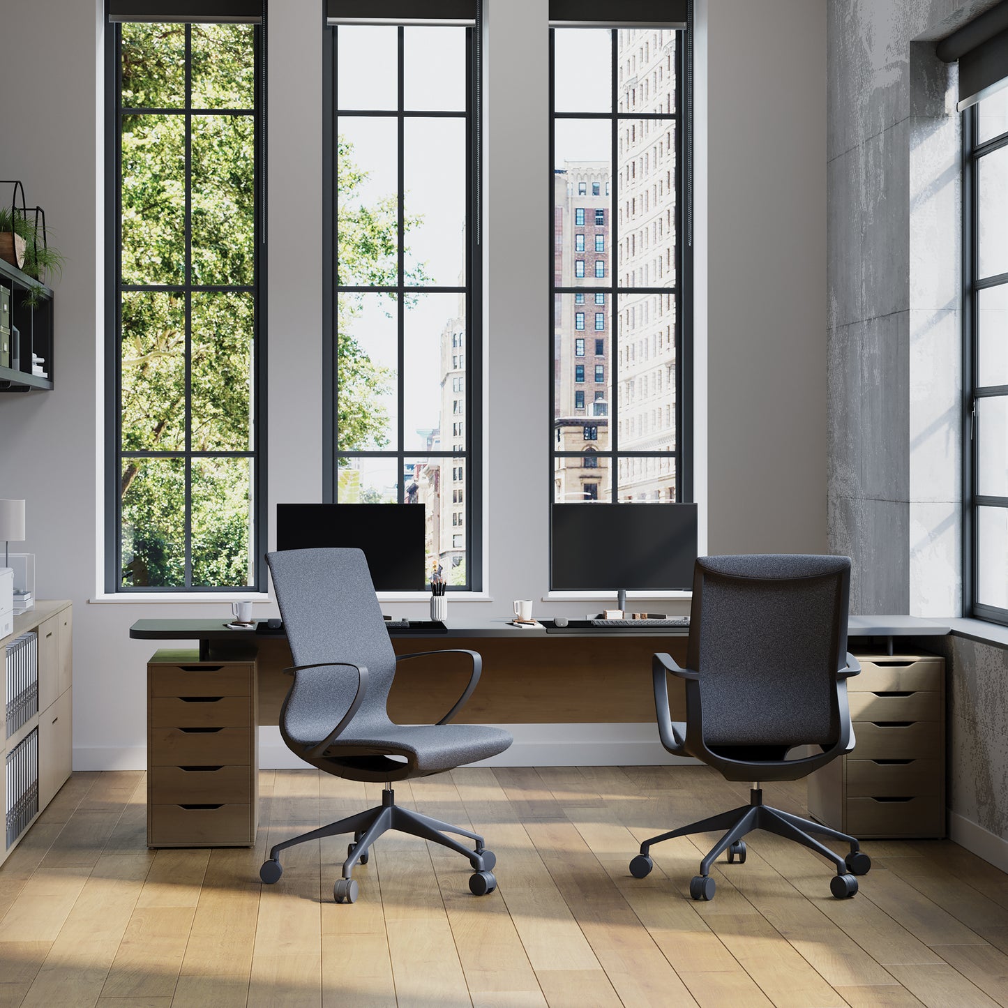 Modern office setup with two chairs and a desk in front of large windows.