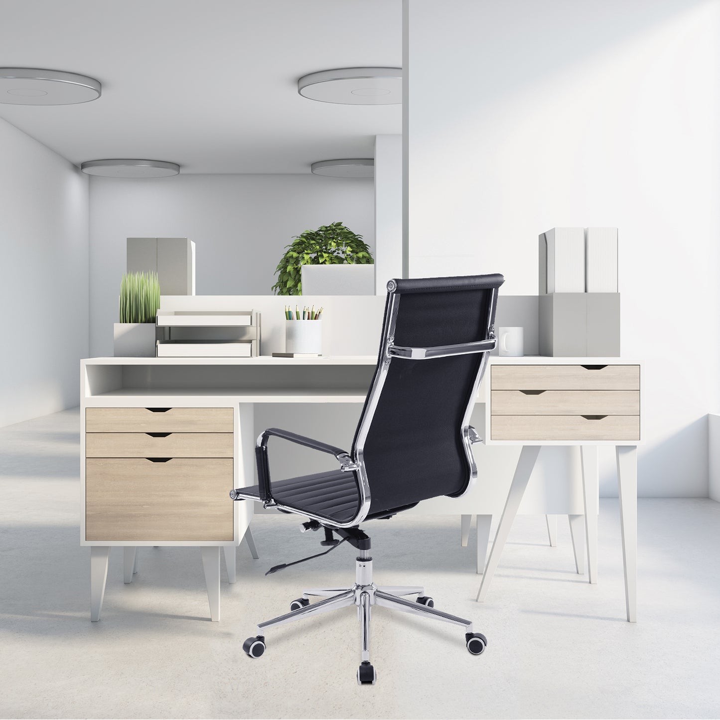 Modern office desk with black chair and white walls
