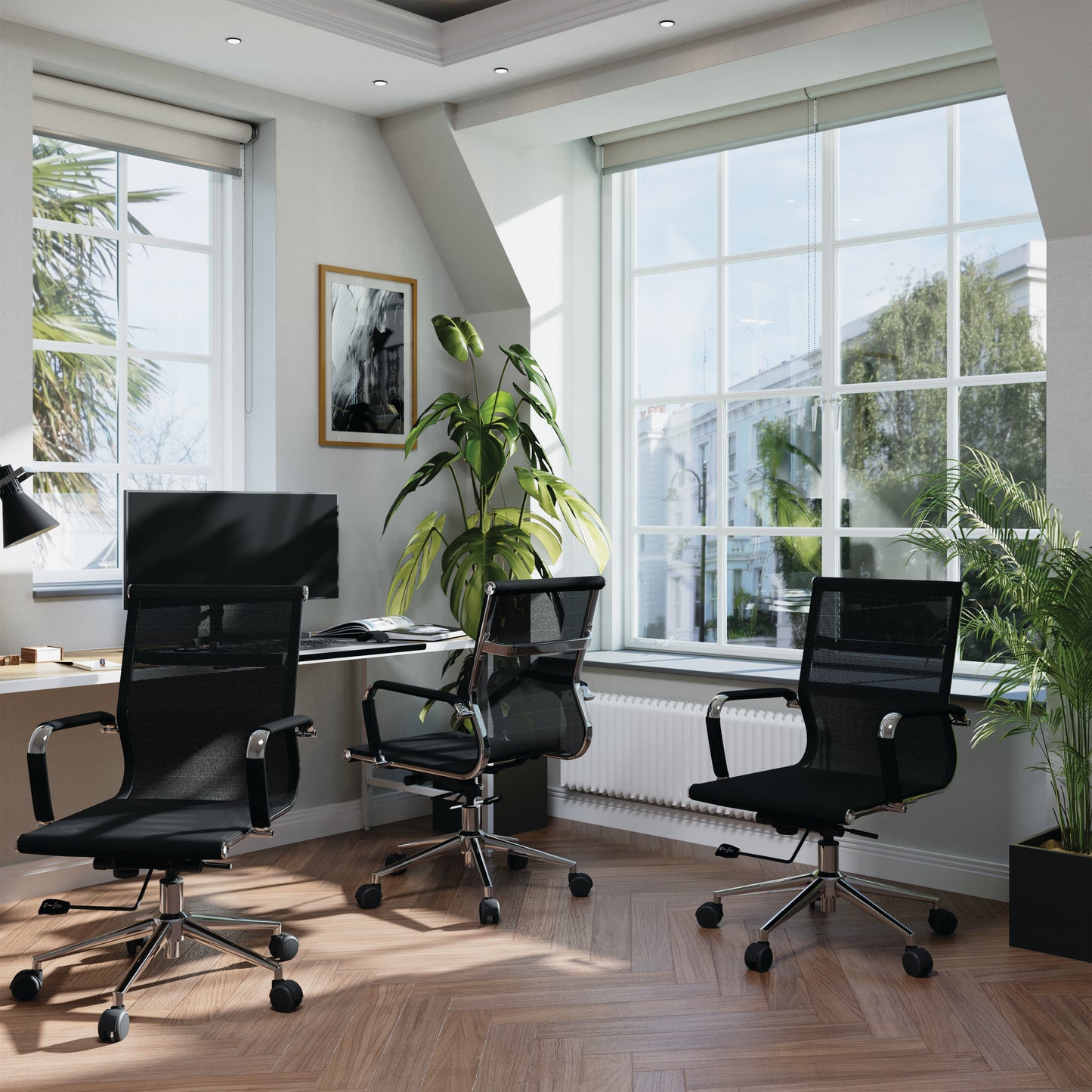 Modern office with black chairs, a desk, and large windows.