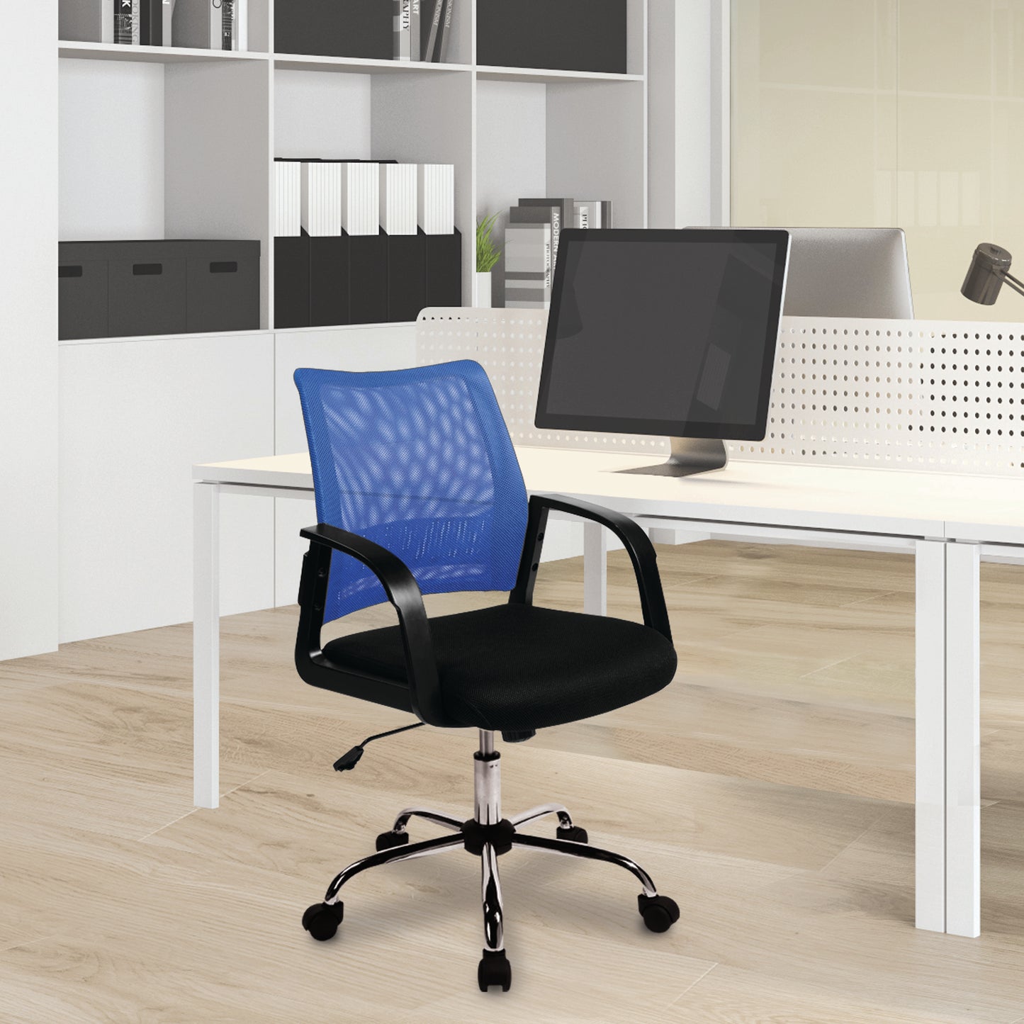 Blue office chair in front of a white desk with computer equipment.