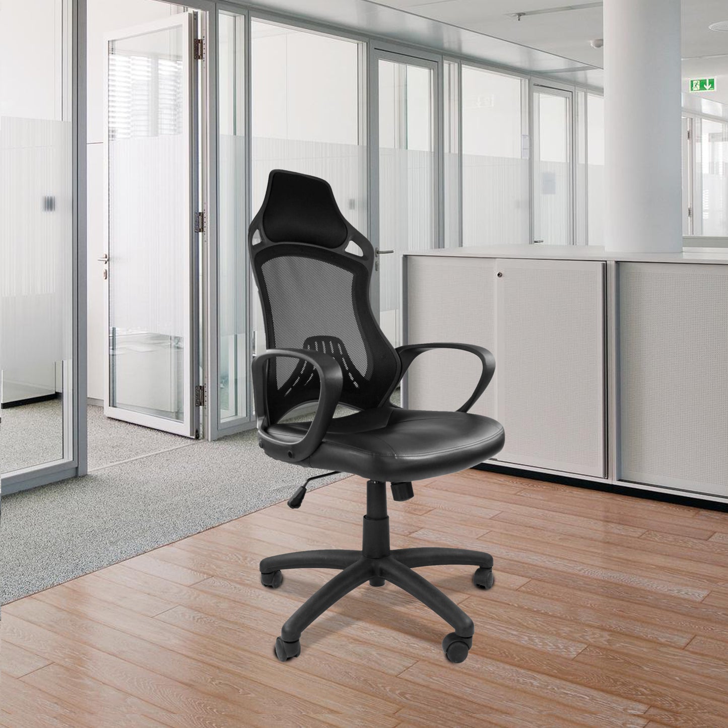 Black office chair in a modern office setting with glass walls and wooden floor.