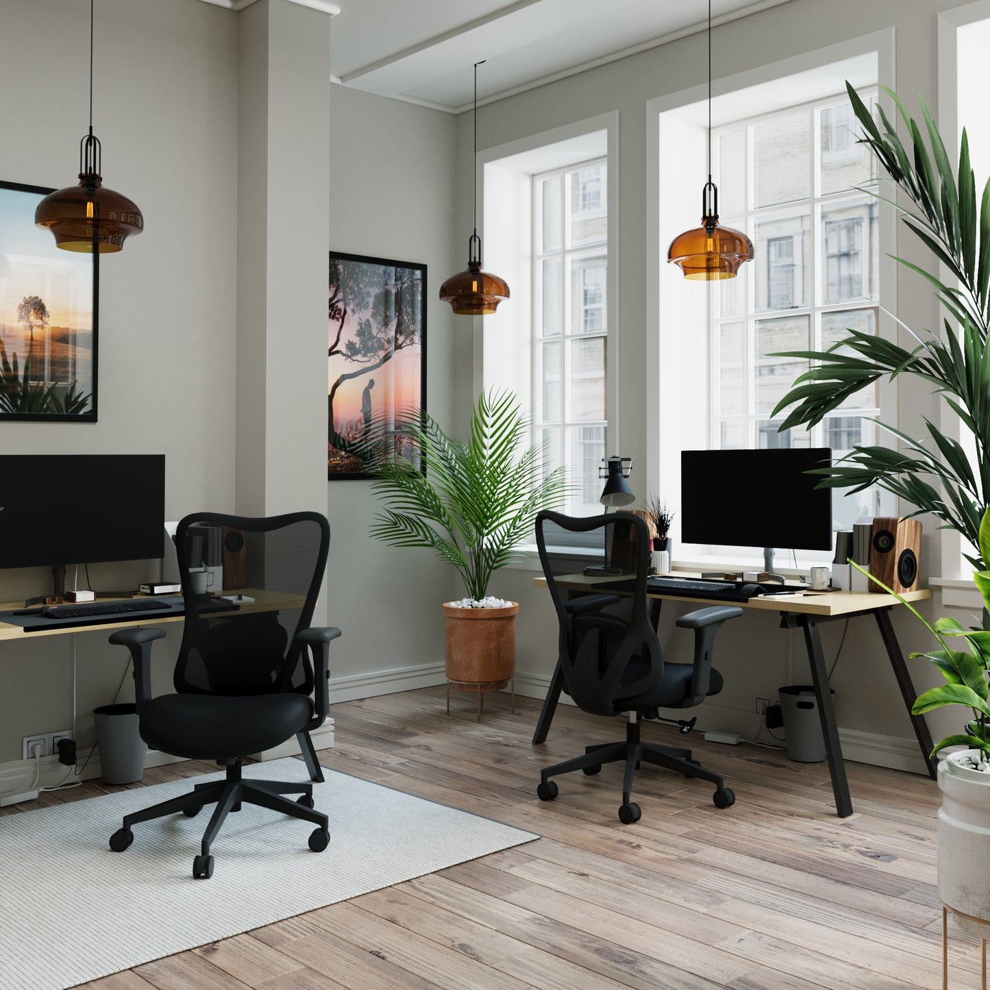 Modern office space with two desks, chairs, and large windows.