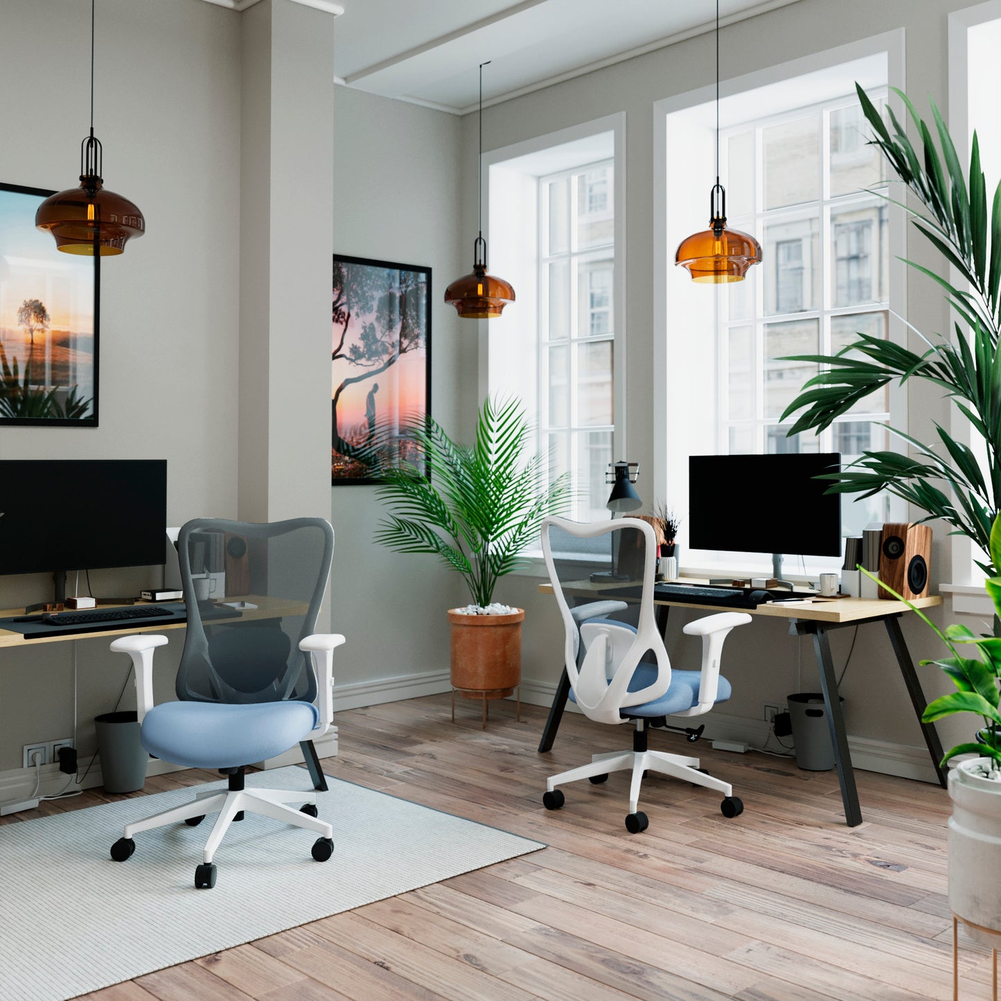 Modern office space with two desks, chairs, and large windows.
