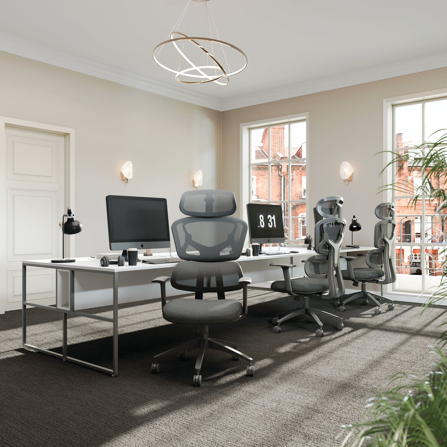 Modern office setup with ergonomic chairs and a desk.