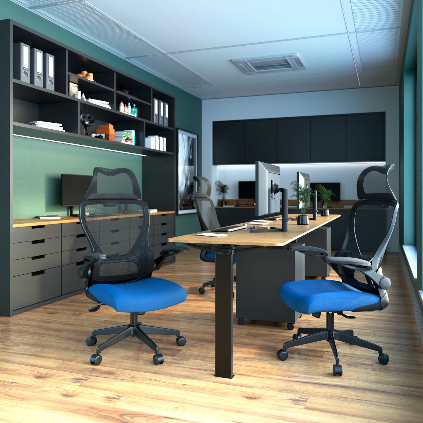 Modern office setup with ergonomic chairs, desks, and computer monitors.