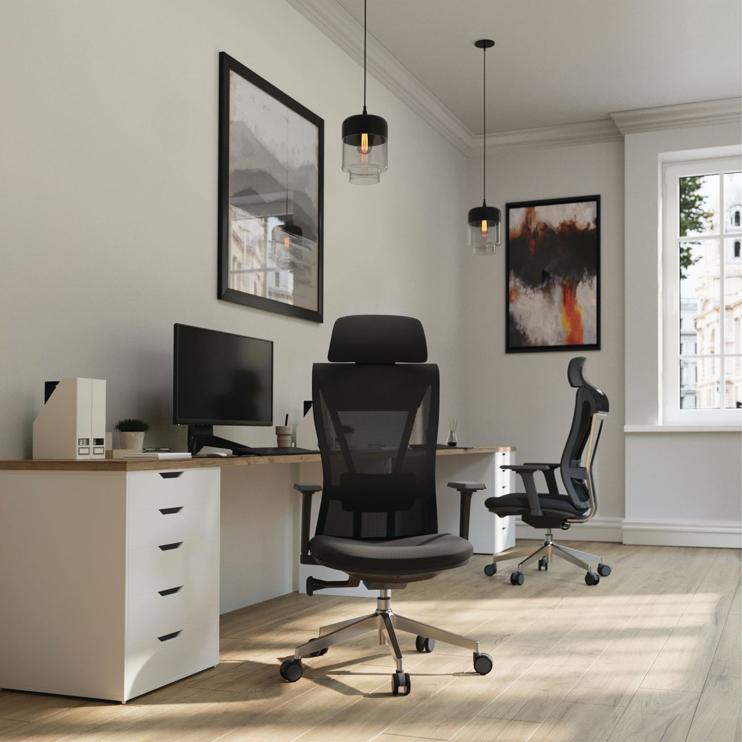 Modern office setup with ergonomic chairs and a desk.