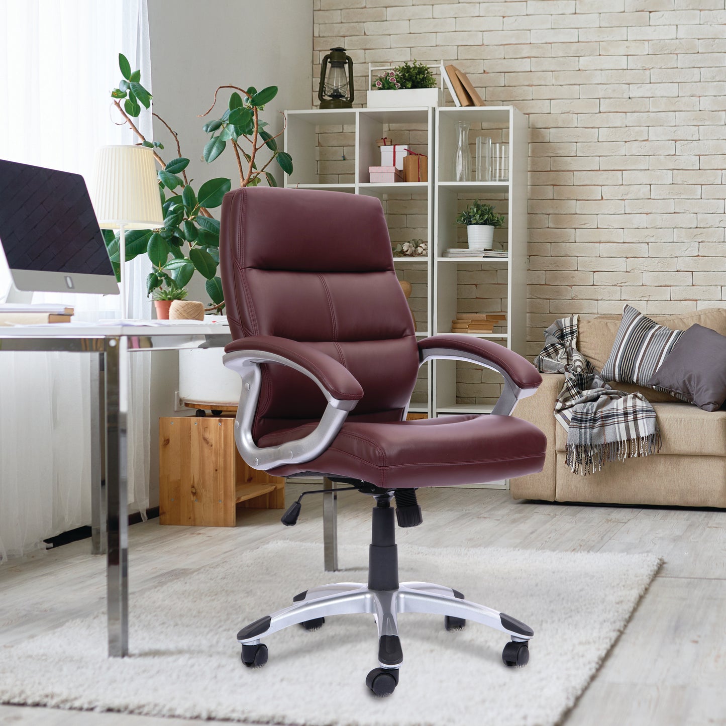 Purple office chair in a home office setting with a desk, computer, and decor.