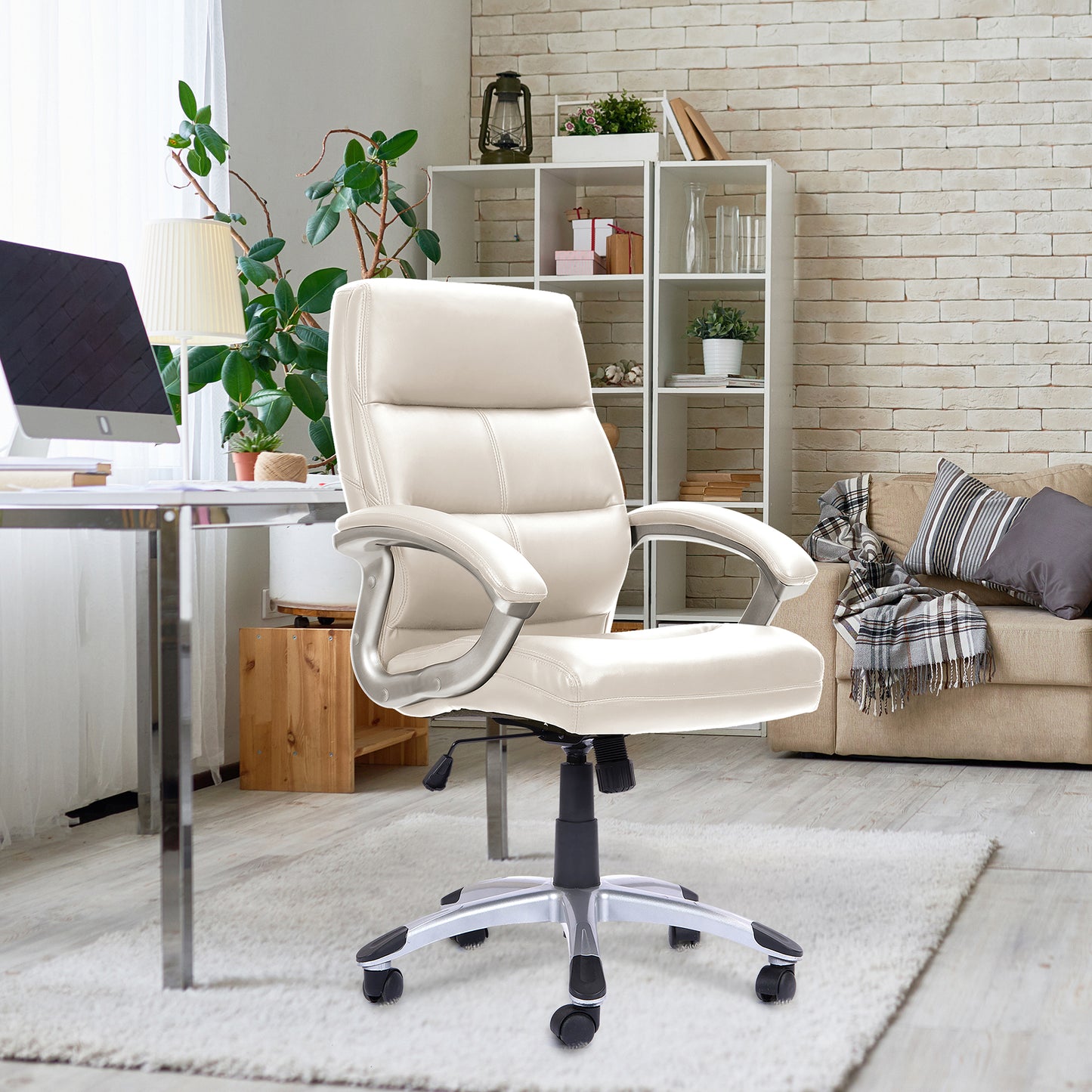 Beige office chair in a home office setting with a desk, computer, and decor.