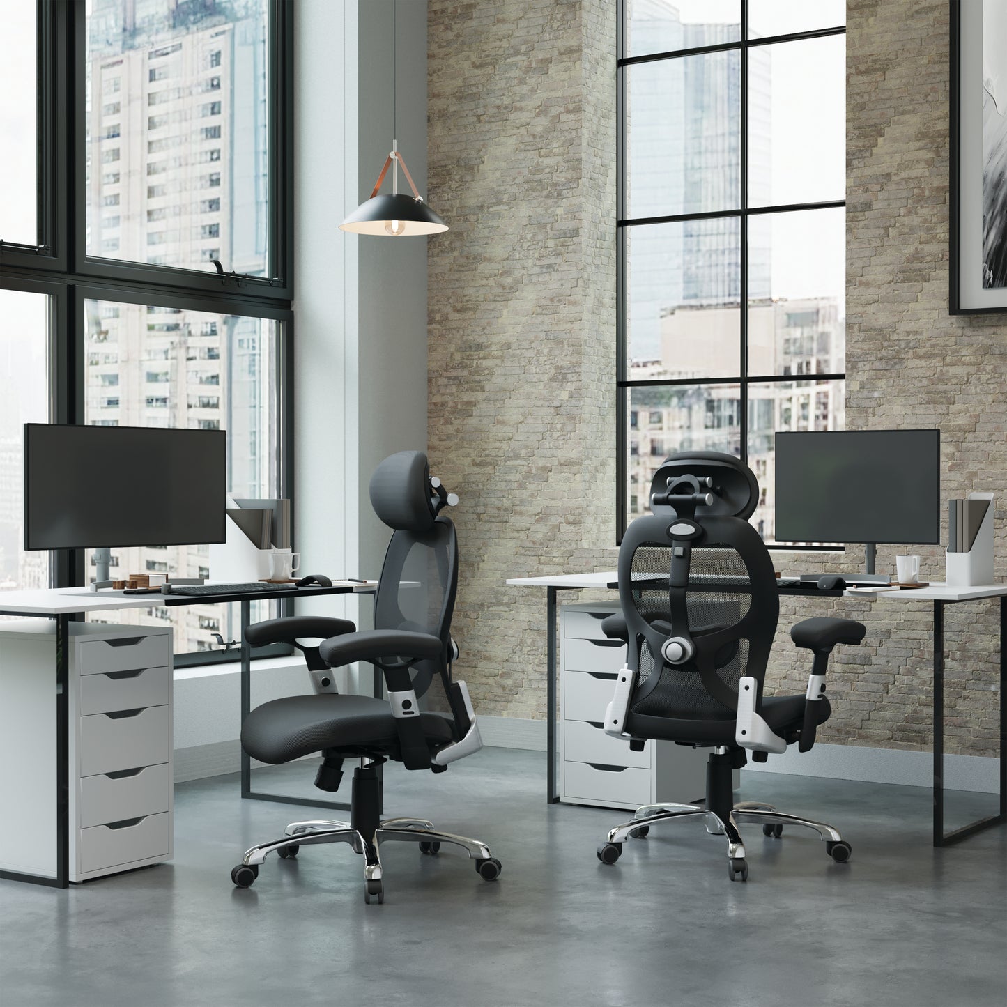 Modern office setup with two ergonomic chairs and desks in a large windowed room.