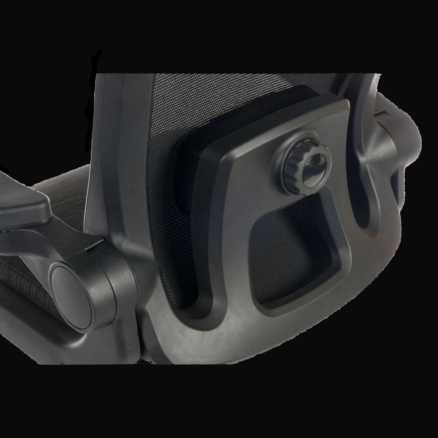 Close-up of a black office chair armrest on a black background