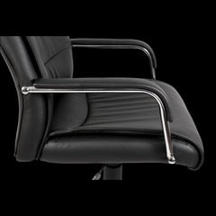 Black office chair with chrome armrests on a black background