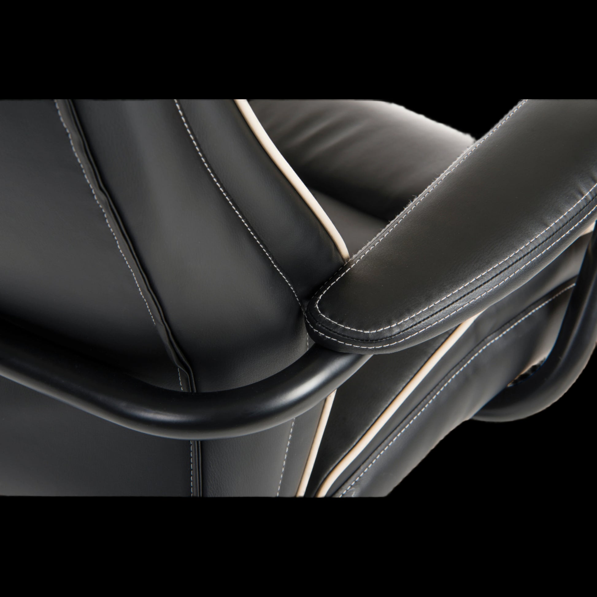 Close-up of a black leather car seat with stitching detail
