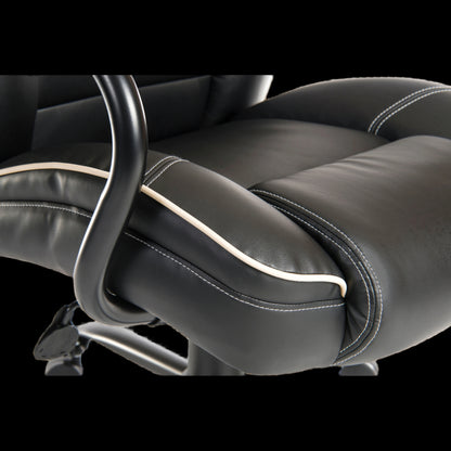 Close-up of a black leather office chair with armrests on a black background