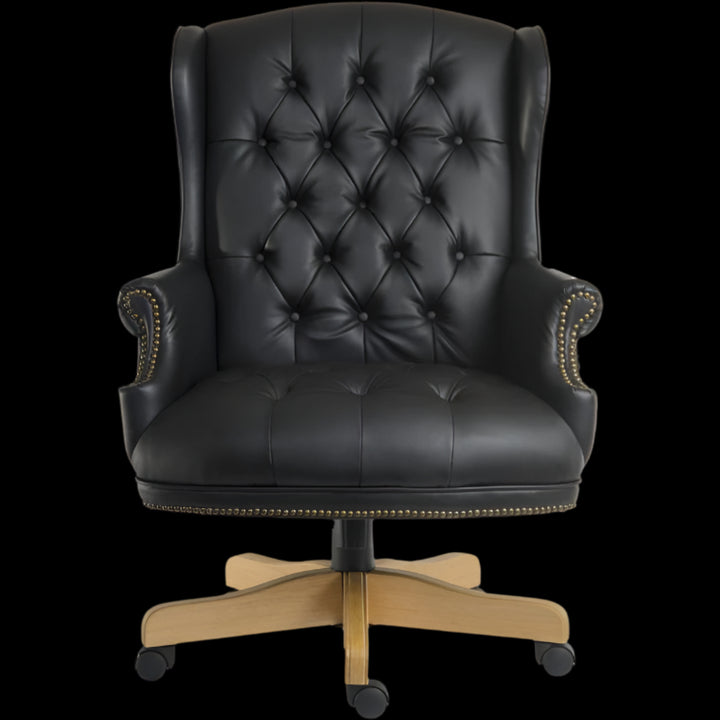 Black leather office chair with wooden base on a black background