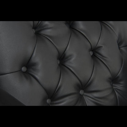 Close-up of a tufted black leather surface