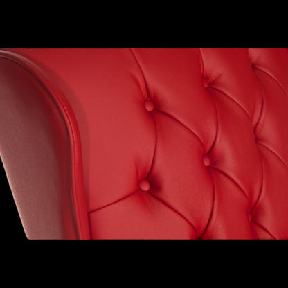 Close-up of a red tufted chair with a black border