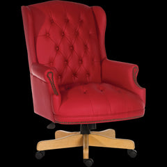 Red leather office chair with wooden base on a black background
