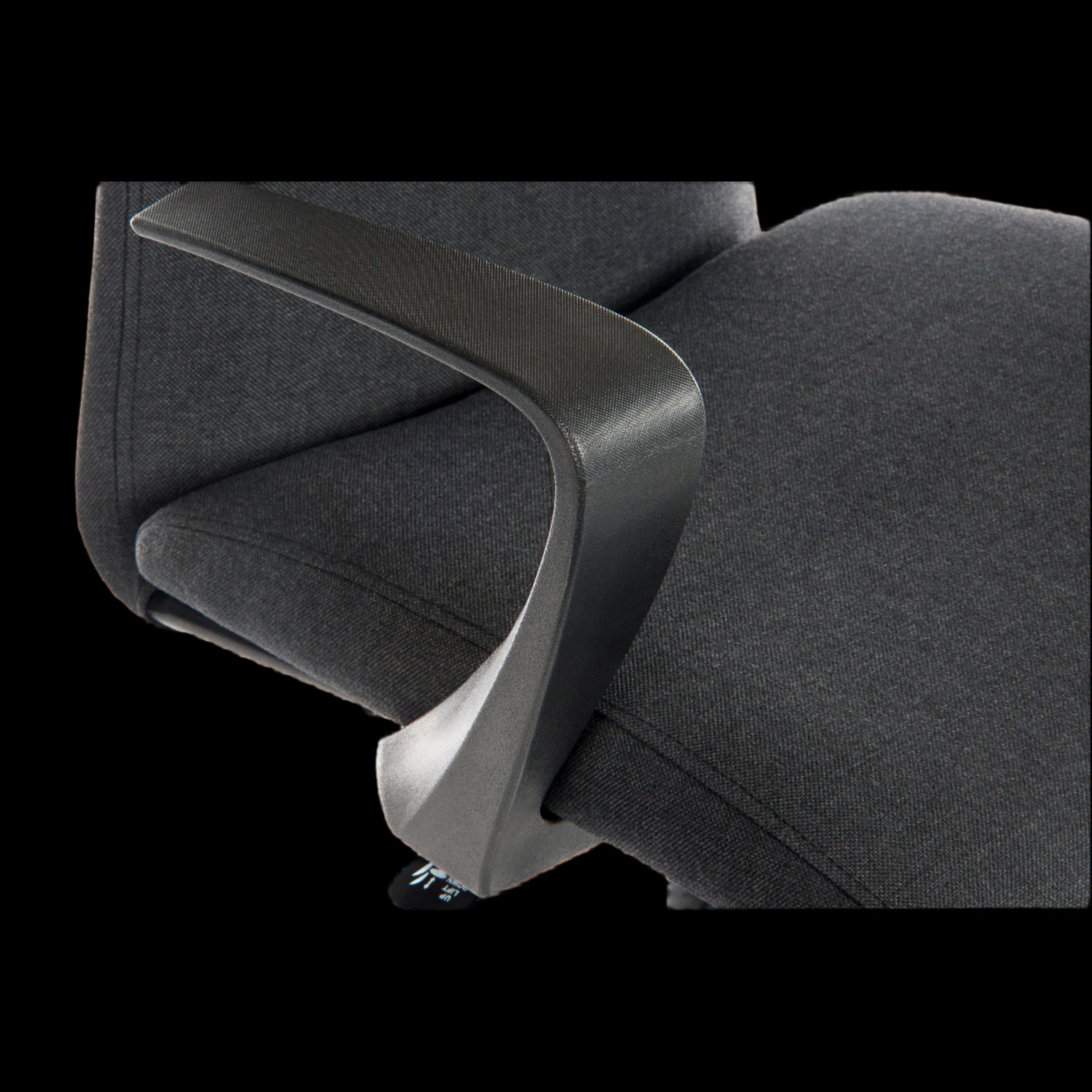 black office chair with armrest detail on a black background