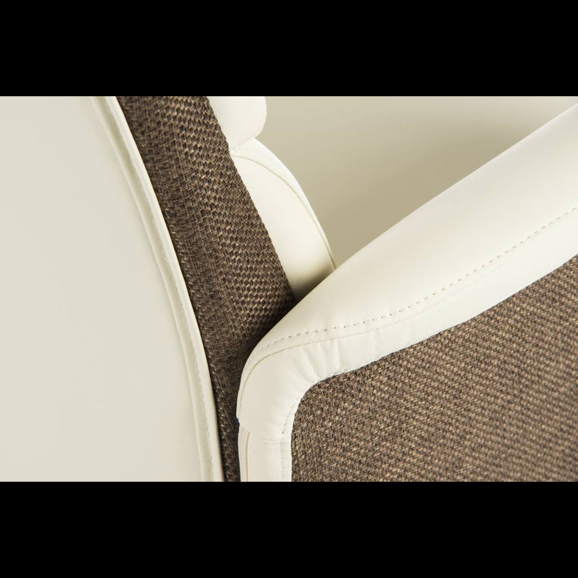 Close-up of a car seat with brown and white fabric