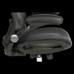 Close-up of a black office chair with adjustable features on a black background