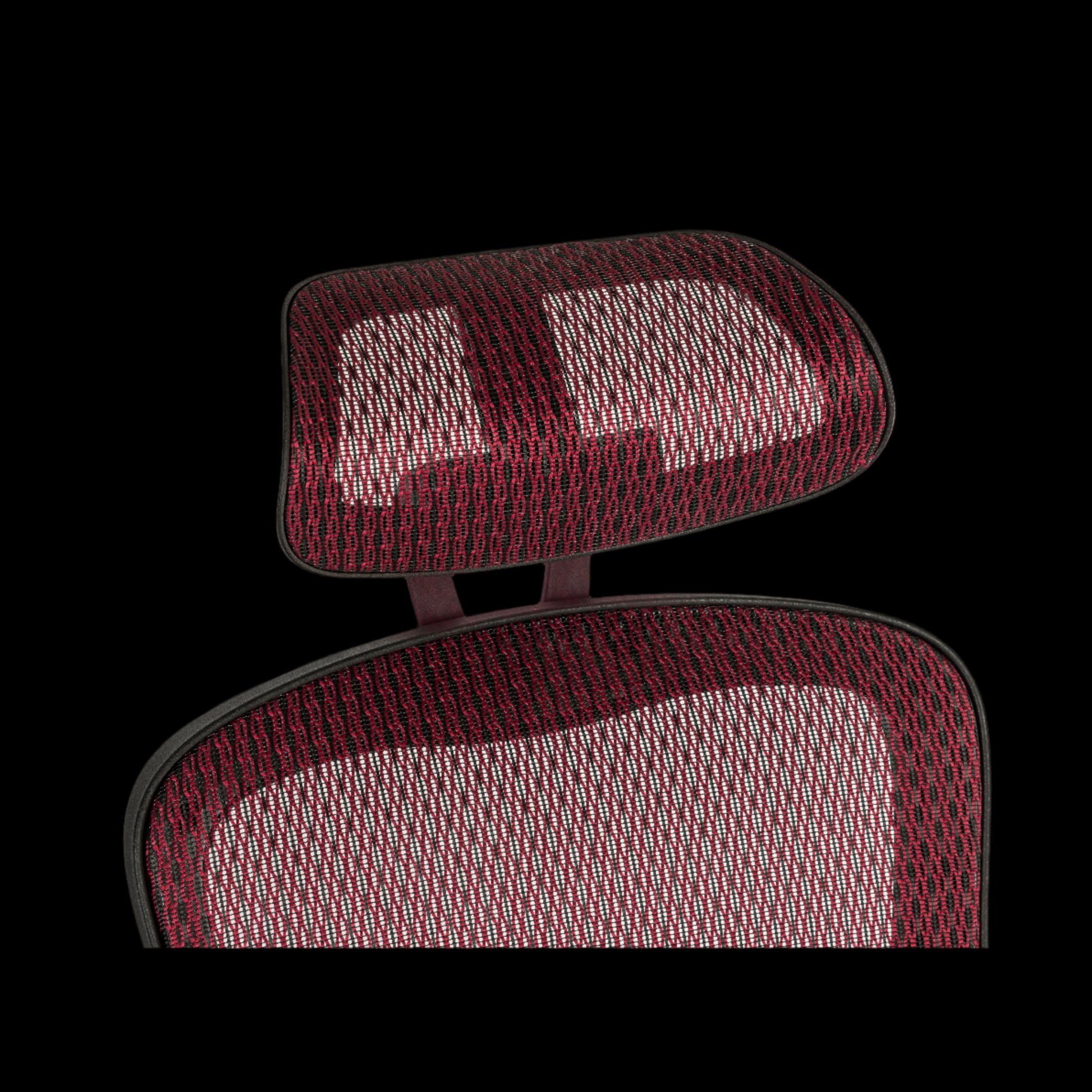 Red mesh office chair seat close up of its headrest on a black background