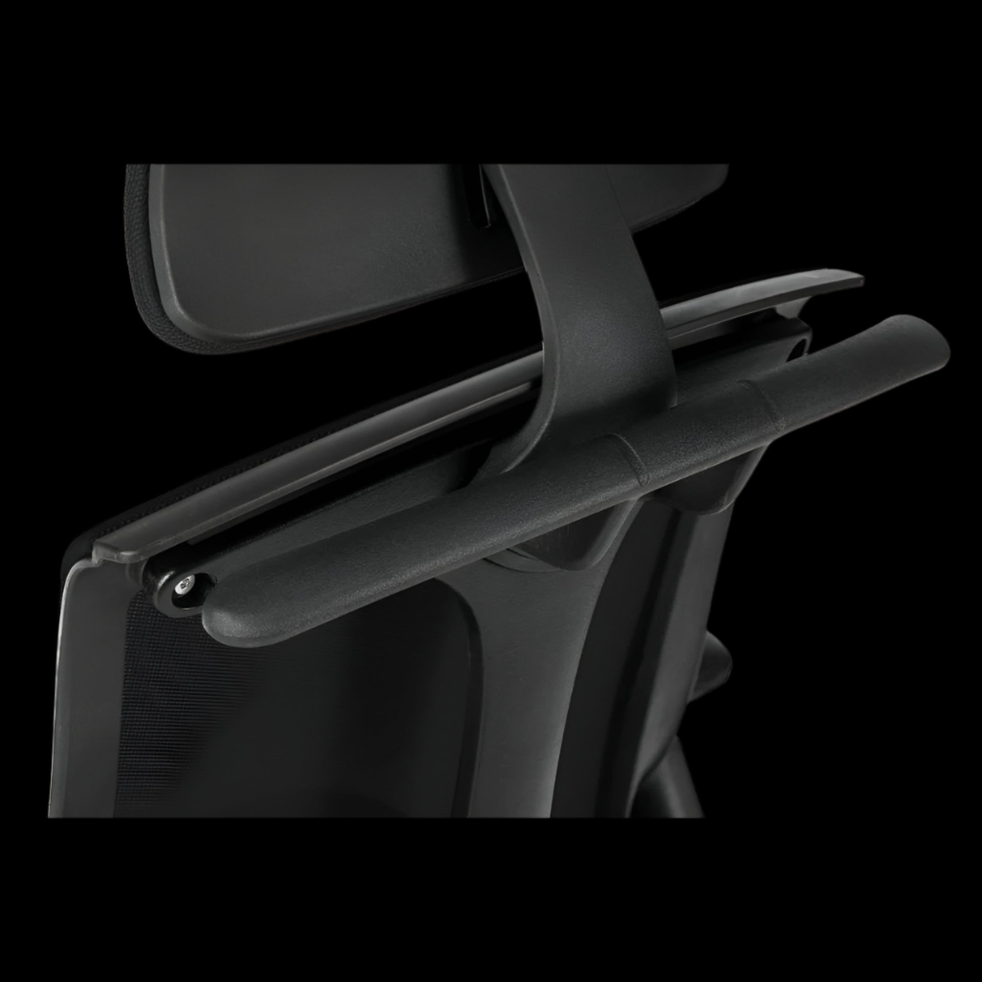 Black office chair with headrest on a black  background