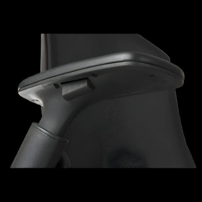 Close-up of a black electronic device with a metallic component on a black background