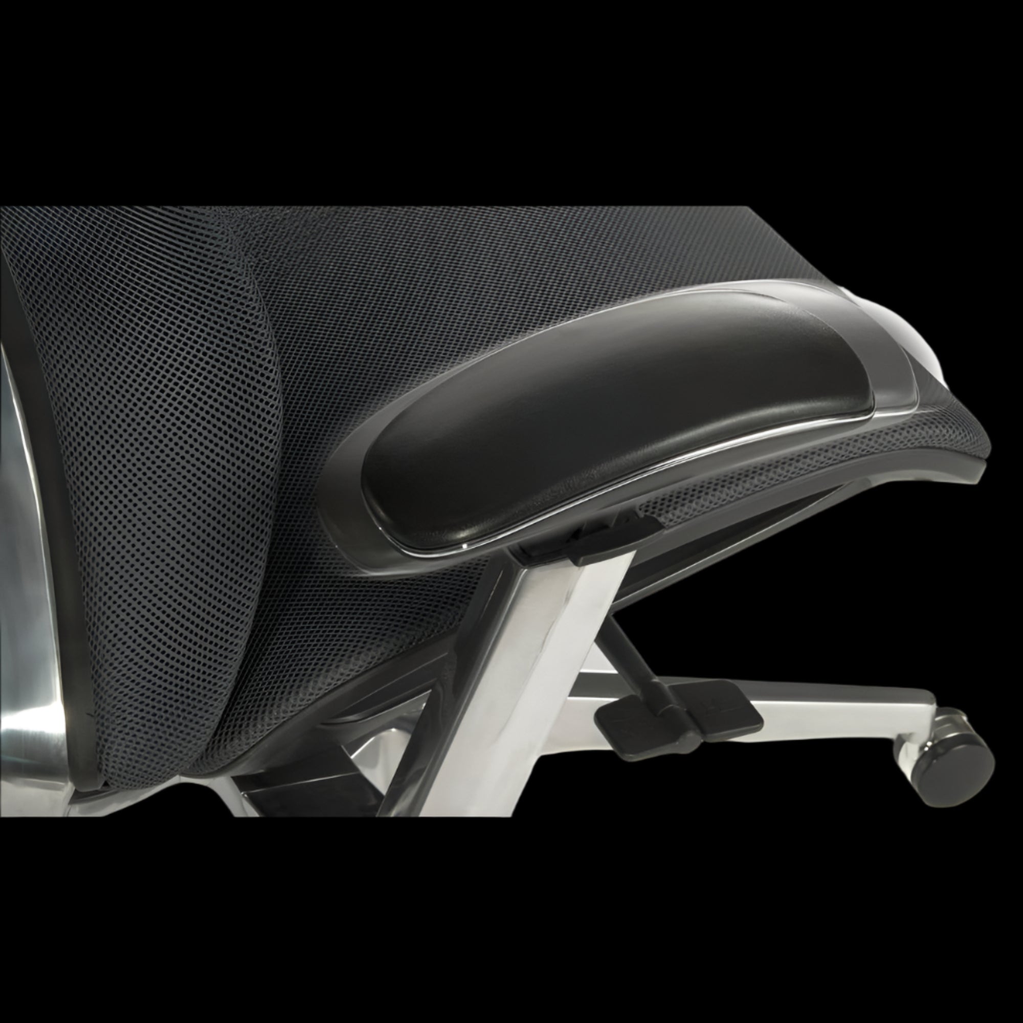 Close-up of a black office chair with mesh backrest and armrests on a black background