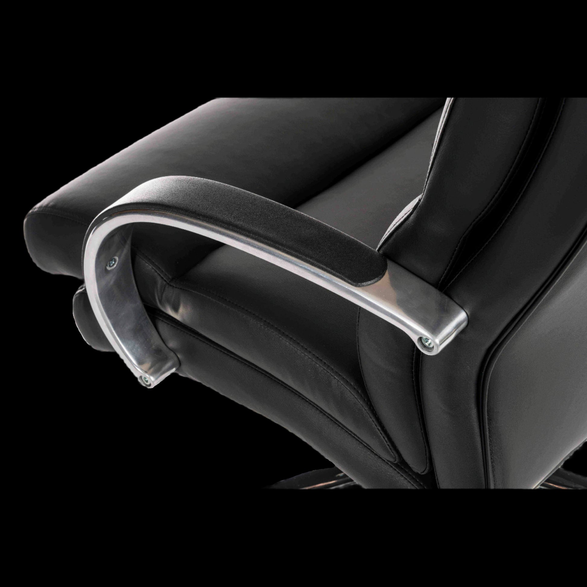 Close-up of a black office chair with armrests on a black background
