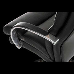Close-up of a black office chair with armrests on a black background