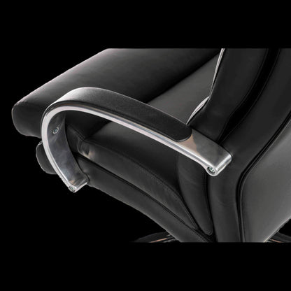 Close-up of a black office chair with armrests on a black background